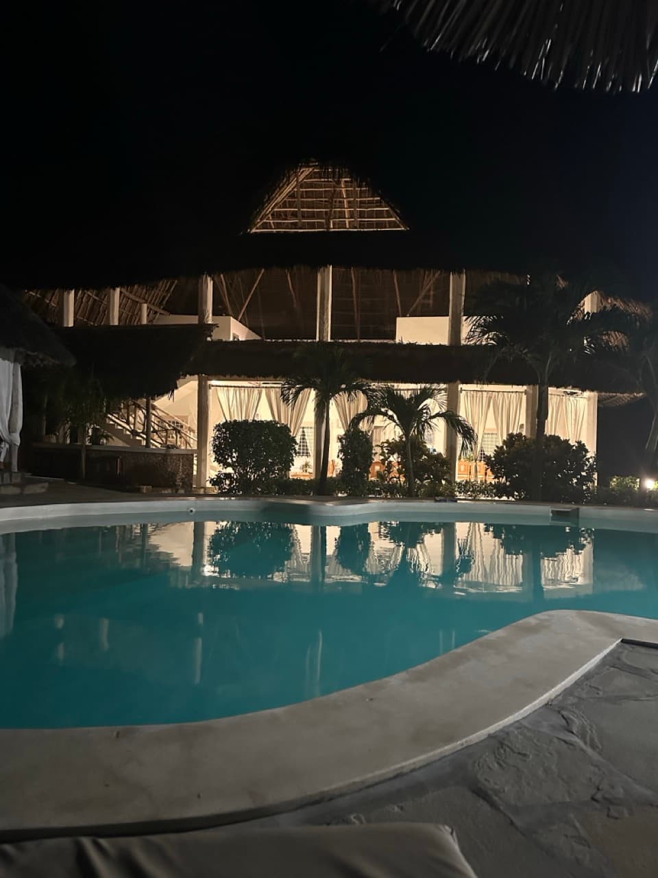 Pool lit up at night at the private villa in Watamu, Kenya